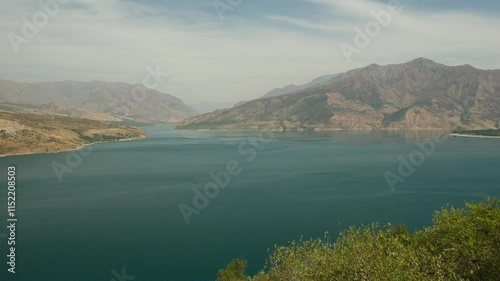 Charvak reservoir and mountains on the horizon photo