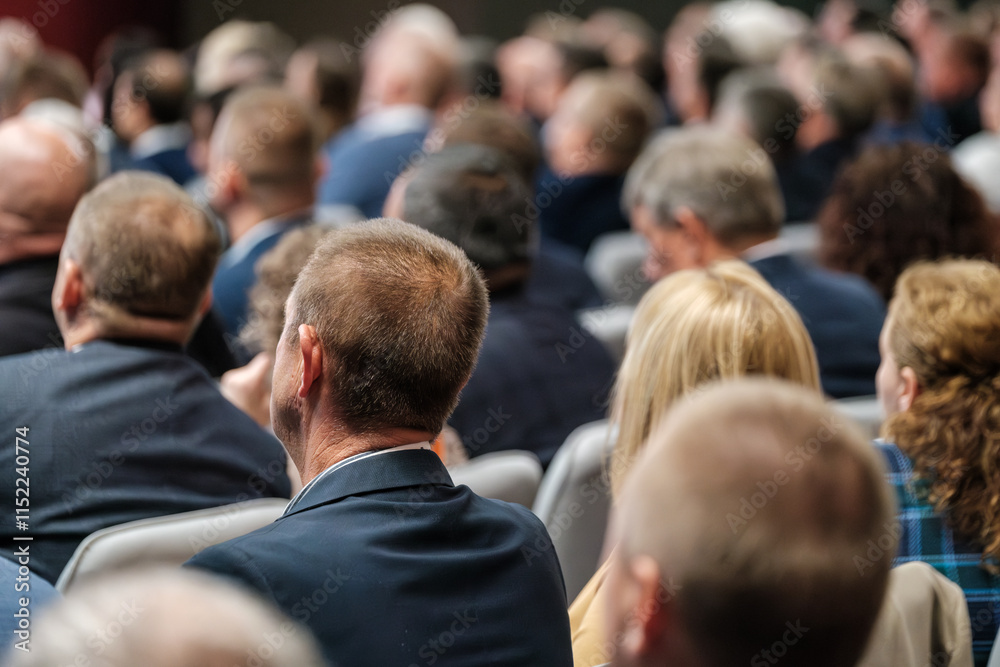 Obraz premium Attendees sitting in a conference room engaged in a professional business event