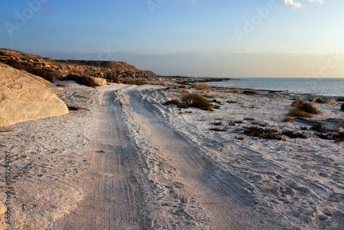 Fotografie Shell coast of the Caspian Sea. Road along the sea.
