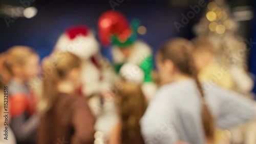 Wallpaper Mural A joyful holiday gathering with Santa and elves in a beautifully blurred background for added charm Torontodigital.ca