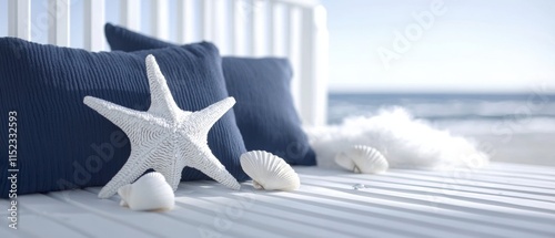 A starfish is sitting on a blue pillow next to some shells photo