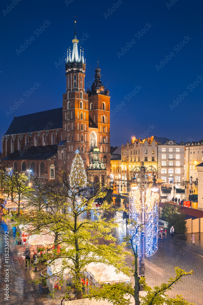 View of the Krakow Christmas Market 2024 and the historic Old Town Square, beautifully illuminated with festive lights and vibrant holiday atmosphere.