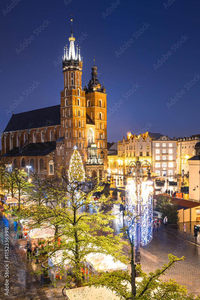 View of the Krakow Christmas Market 2024 and the historic Old Town Square, beautifully illuminated with festive lights and vibrant holiday atmosphere.