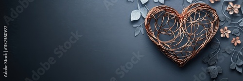 Delicate heart in warm, romantic setting with rose-gold and gray tones photo