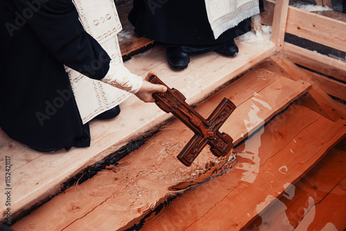 Schilderij op canvas Priest consecrating river water baptism, holy father hold cross crucifix in hand