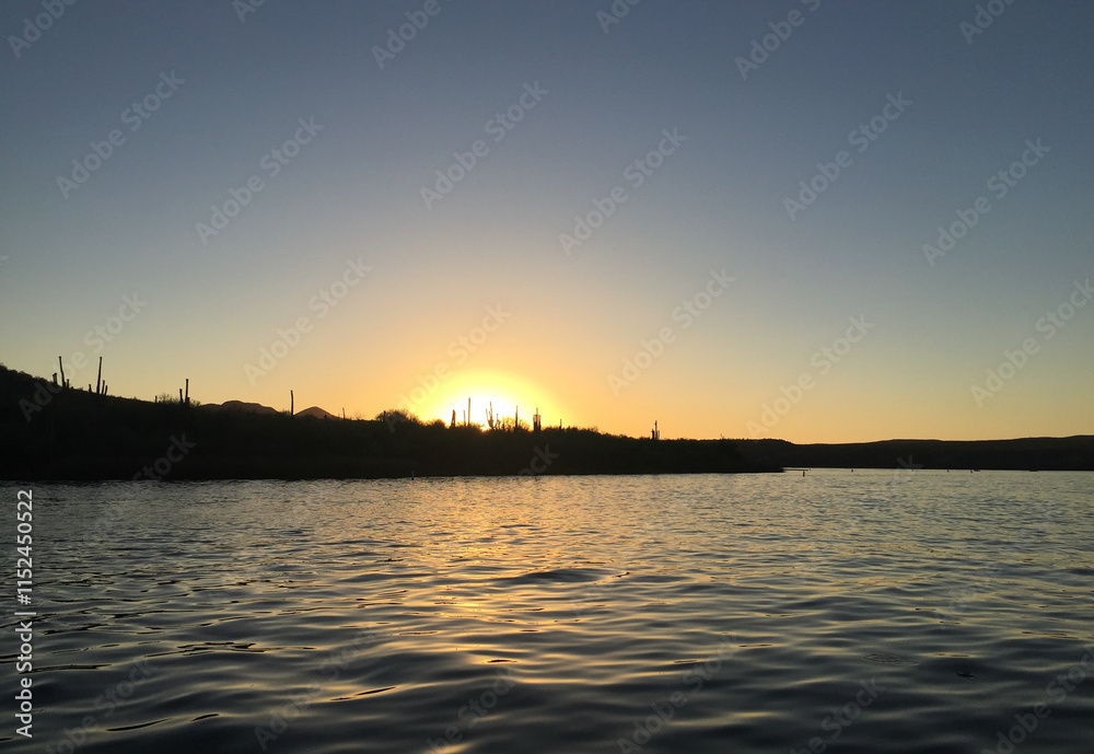 Sunset over a lake with a desert horizon Sunset over a lake with a desert horizon
