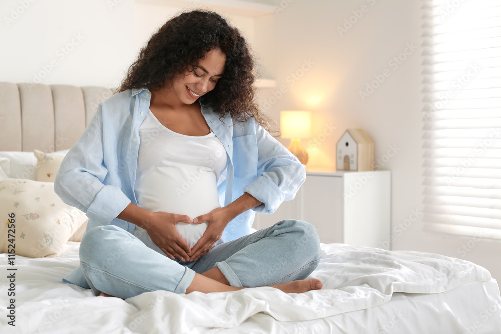 Portrait of beautiful pregnant woman on bed at home Portrait of beautiful pregnant woman on bed at home