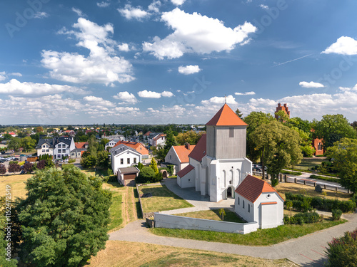 Obraz na płótnie Summer skyline cityscape of Tarnowo Podgórne, Poznań County, Greater Poland Voivodeship (Wielkopolska). Aerial panoramic view of catholic church. w salonie