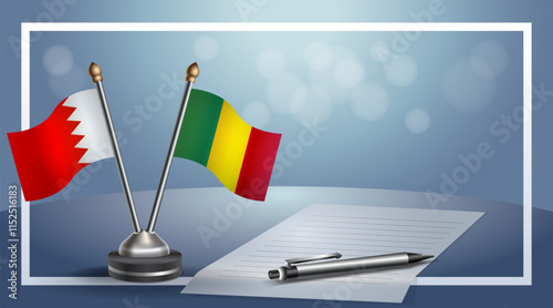 Bahrain and Mali National flags on small table with bokeh background, cooperative relationship