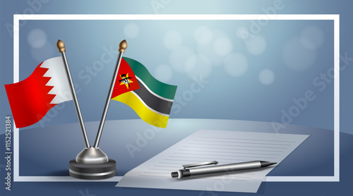 Bahrain and Mozambique National flags on small table with bokeh background, cooperative relationship