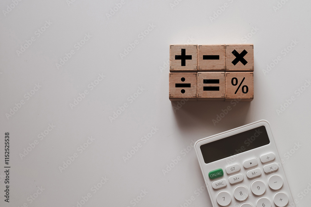 Mathematical symbols on woodencube with calculator concept for math education, financial calculations,business. Mathematical symbols on woodencube with calculator concept for math education, financial calculations,business.