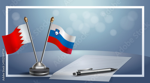 Bahrain and Slovenia National flags on small table with bokeh background, cooperative relationship