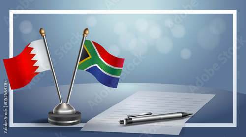 Bahrain and South Africa National flags on small table with bokeh background, cooperative relationship