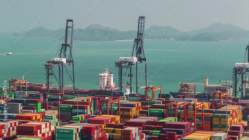 SHENZHEN, CHINA - NOVEMBER 7, 2024: Busy port operations with cargo ships and containers in Shenzhen during the midday sun