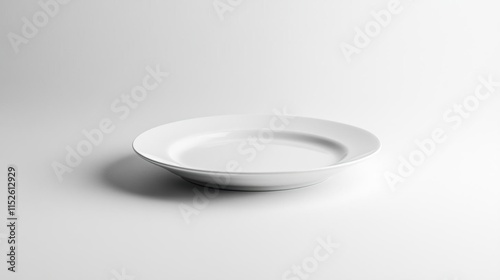 a white plate on a white surface with a white background photo