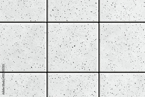 A white tile floor with black spots