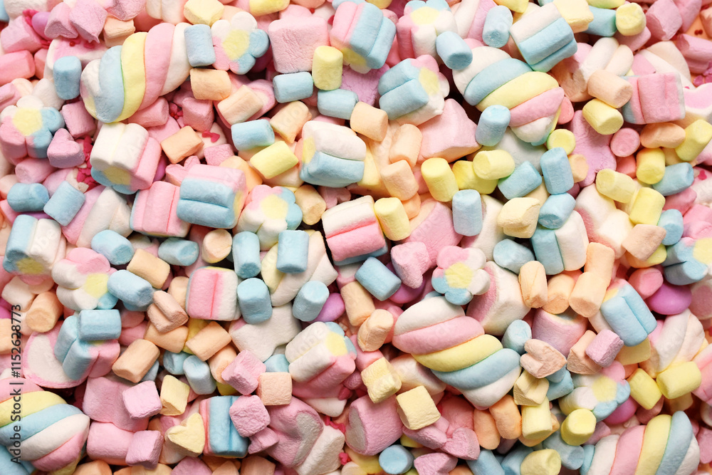 Confectionery and sweeties varieties background: light pink and white marshmallows, sugar confetti, bonbon and candies, selective focus, shallow focus Confectionery and sweeties varieties background: light pink and white marshmallows, sugar confetti, bonbon and candies, selective focus, shallow focus