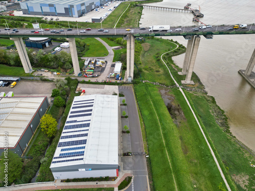 High Angle View of Dartford City of River Thames Dartford Channel Bridge Crossing, Estuary, Thurrock in Essex, England United Kingdom. Aerial Footage Captured with Drone's Camera on April 14th, 2024 photo