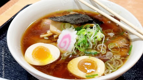 4K Traditional Japanese soy sauce ramen with egg bowl.