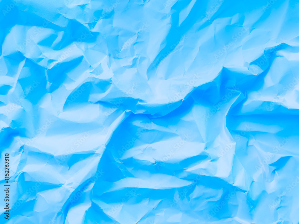 Obraz premium Blue abstract background paper crumpled crease wallpaper rough art scrapbook, card cosmetic product or business finance, template empty vintage wallpaper summer travel, texture sheet wrinkled.