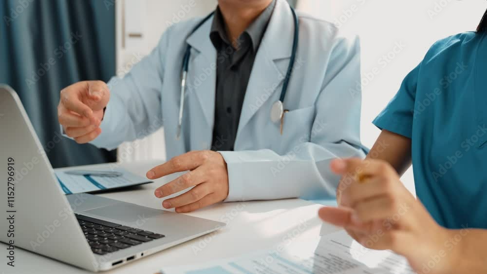 Professional various team of healthcare worker working and planning medical treatment at hospital table together. Teamwork lead to successful illness and sickness treatment. Slow motion. Rigid. Professional various team of healthcare worker working and planning medical treatment at hospital table together. Teamwork lead to successful illness and sickness treatment. Slow motion. Rigid.