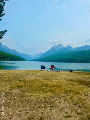 Two lawn chairs overlooking the mountains at Glacier National Park photo