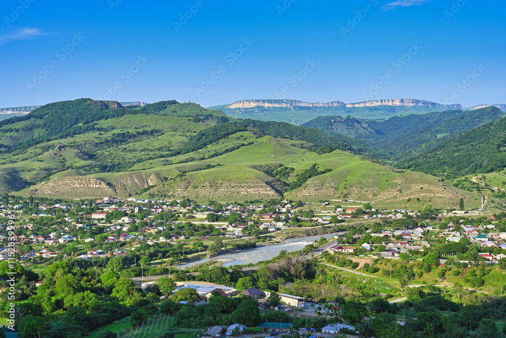 Obraz premium Mountain landscape of the village Kosta Khetagurov on a summer day, Karachay-Cherkessia Republic of Russia