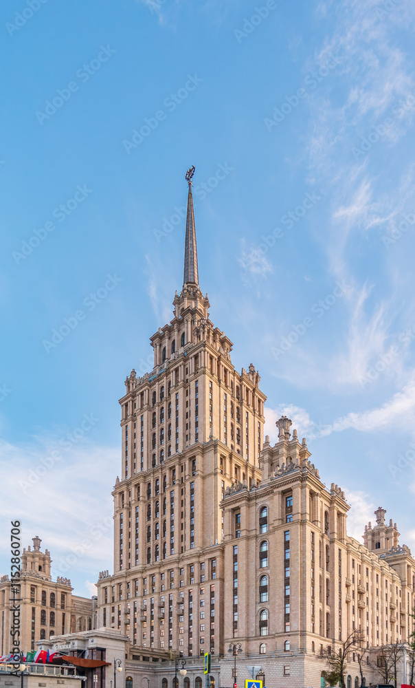 high-rise stalinist building near river at summer sunset in Moscow, Russia. Historic name is Hotel Ukraine. high-rise stalinist building near river at summer sunset in Moscow, Russia. Historic name is Hotel Ukraine.