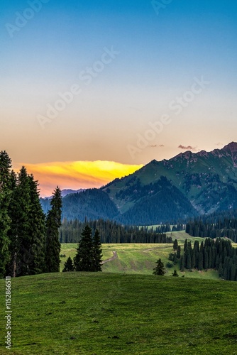 Stunning sunset over Kuldinin Natural Scenic Area in Ili Kazakh Autonomous Prefecture, Xinjiang photo