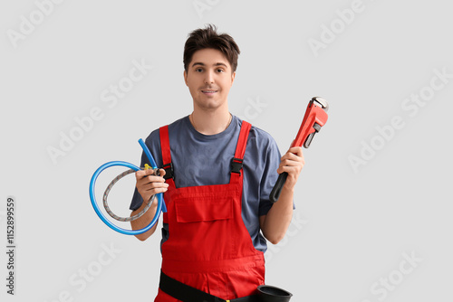 Male plumber with pipe wren...
