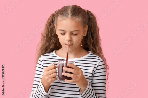 Cute girl with glass of swe...