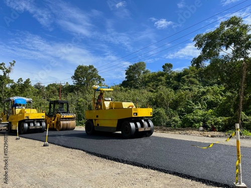 Wallpaper Mural road paving process using heavy equipment, Asphalt Paver and Tandem roller Torontodigital.ca