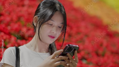 Woman using smartphone at night, Night lights, Bokeh of lights.