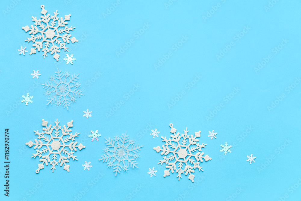 Beautiful decorative snowflakes on blue background Beautiful decorative snowflakes on blue background