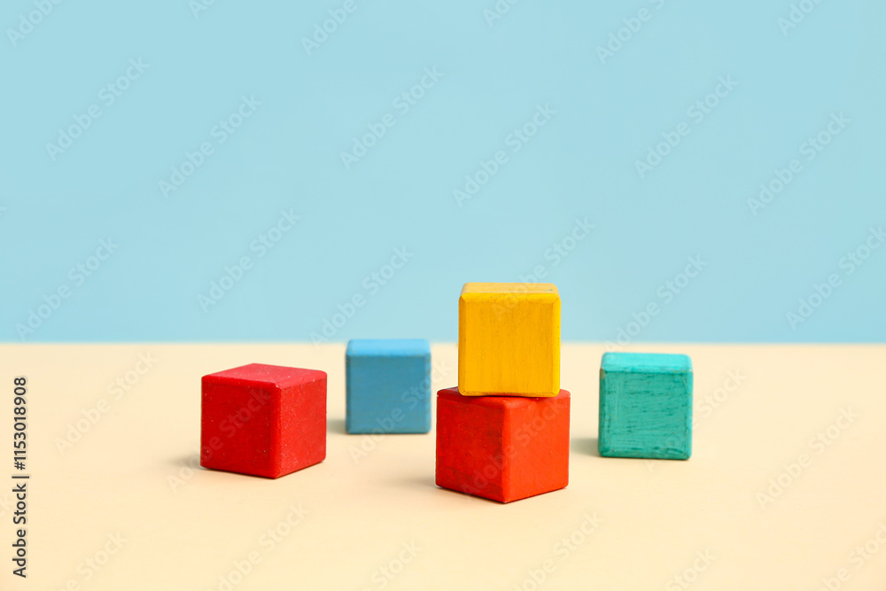 Fototapeta premium Colorful building cubes on color background
