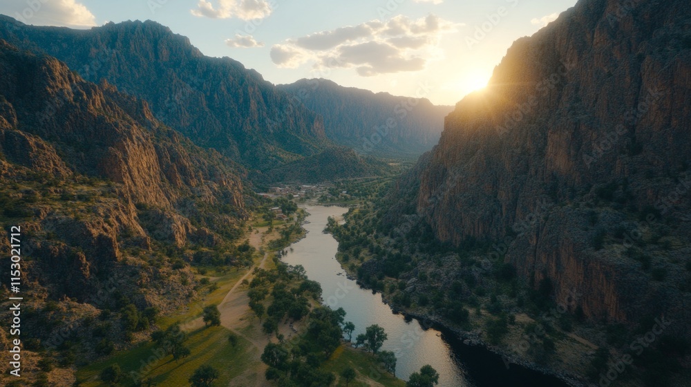 Fototapeta premium Sunset Over Serene Mountain Valley River Landscape