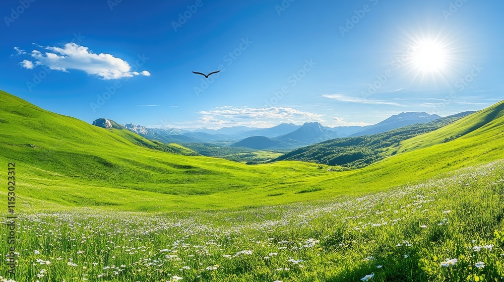 Obraz premium A serene landscape featuring rolling green hills, mountains, and a bright blue sky.