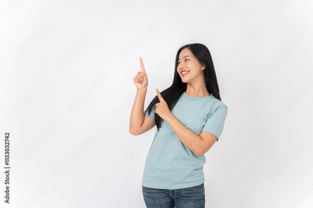 A beautiful Asian woman on a studio background, pointing her finger up as she recommend something. A beautiful Asian woman on a studio background, pointing her finger up as she recommend something.