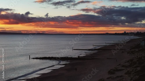 Wallpaper Mural Calm Beach at sunset. Southbourne, UK. Panning drone shot. Torontodigital.ca