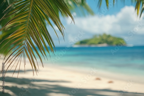 Idyllic tropical beach scene with palm fronds in foreground  showcasing turquoise ocean and island.