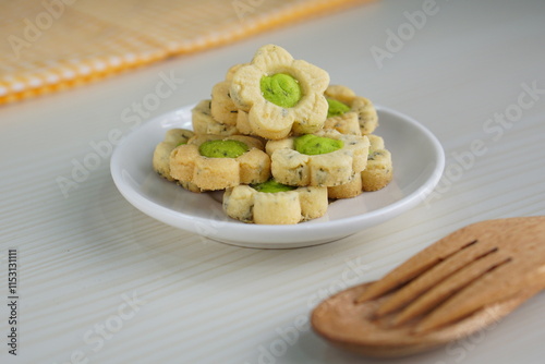 Indonesian mint cookies photographed on a white table with a wooden theme in an indoor studio