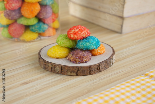 Indonesian colorful granulated sugar sprinkled biscuits photographed with a wooden theme in an indoor studio