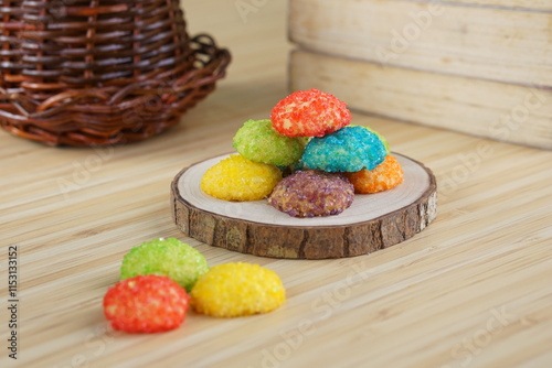 Indonesian colorful granulated sugar sprinkled biscuits photographed with a wooden theme in an indoor studio
