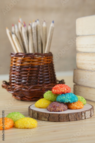 Indonesian colorful granulated sugar sprinkled biscuits photographed with a wooden theme in an indoor studio
