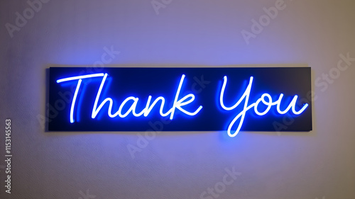 A vibrant blue neon sign illuminates the words 