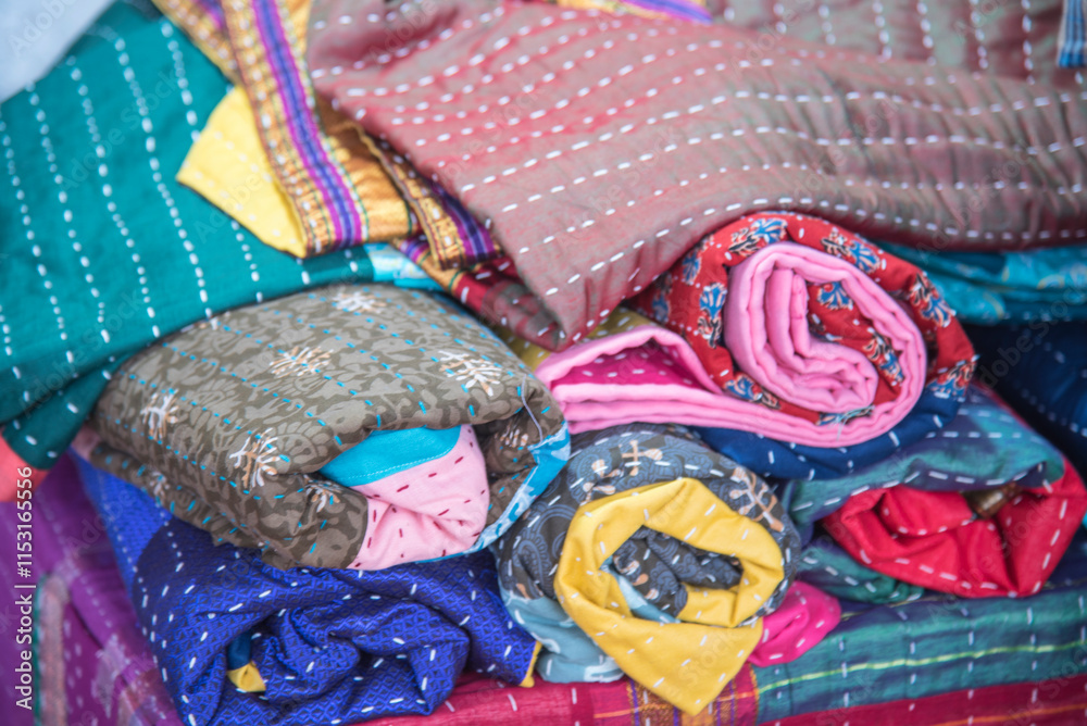 Obraz premium Godhadi (Blanket), handstitched quilt featuring a patchwork of different fabrics and patterns., colorful quilts, beautiful bedspreads