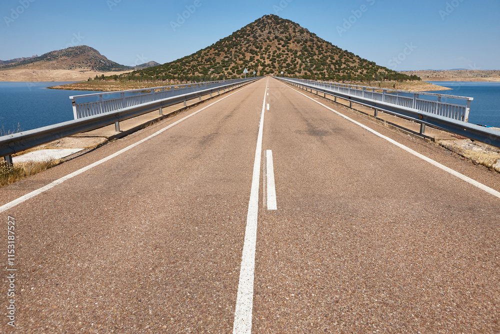 Picturesque hill pyramidal shape huge roundabout and road. Extremadura, Spain