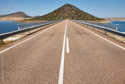 Picturesque hill pyramidal shape huge roundabout and road. Extremadura, Spain photo