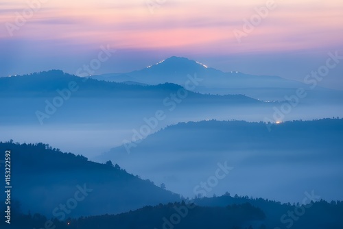 Serene Misty Mountains with Layers of Hills at Dawn or Dusk, Creating a Dreamy and Ethereal Landscape.