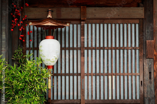 Traditional japanese style lantern decoration in front of wooden door.of traditional japanese houses 